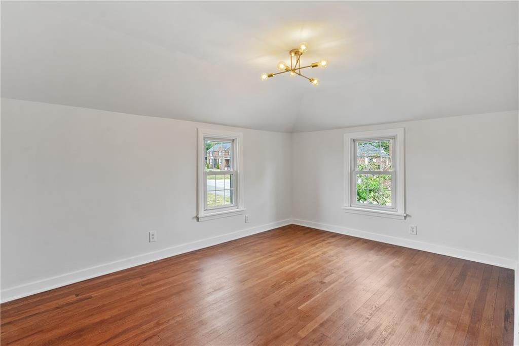 1017 McCoy Road McKees Rocks, PA 15136 - Photo 21 of 30 wooden floor in an empty room with a window