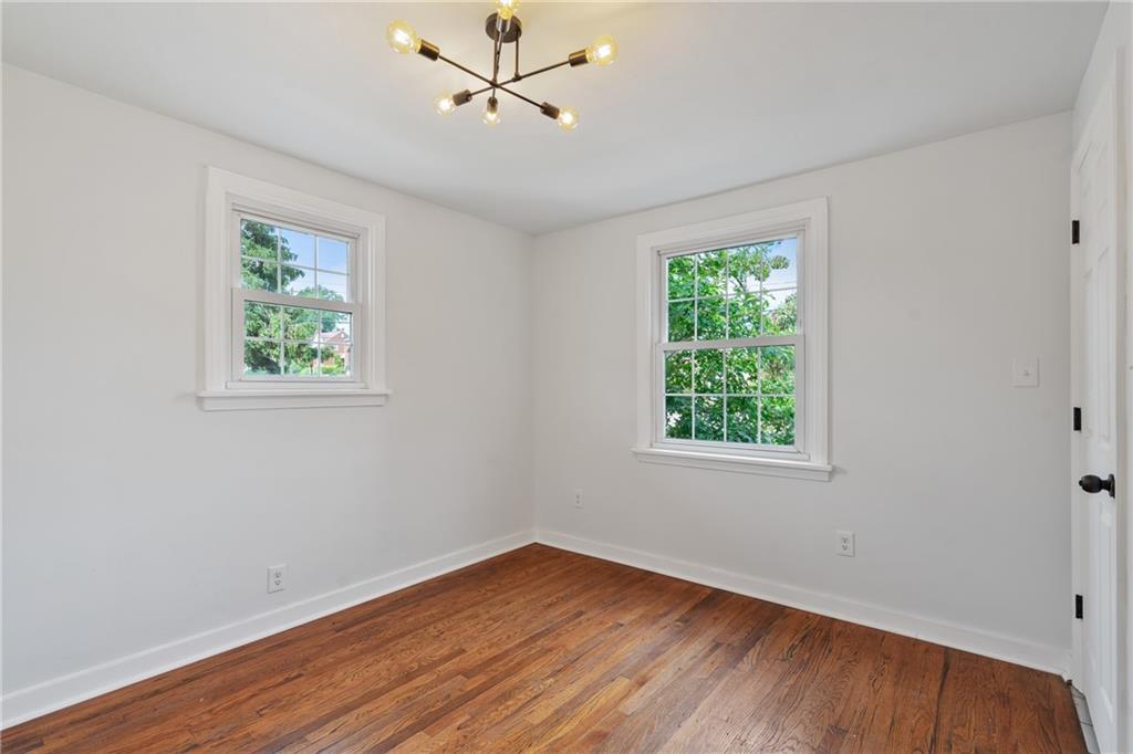 1017 McCoy Road McKees Rocks, PA 15136 - Photo 22 of 30 a view of empty room with wooden floor and fan