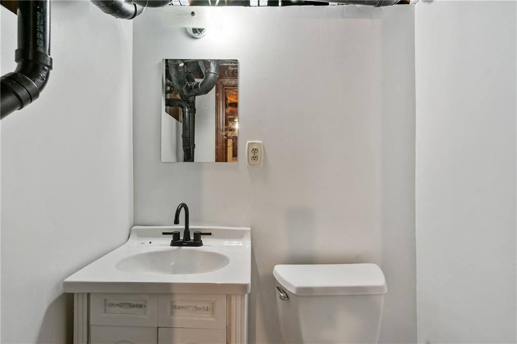 1017 McCoy Road McKees Rocks, PA 15136 - Photo 23 of 30 a bathroom with a sink and mirror