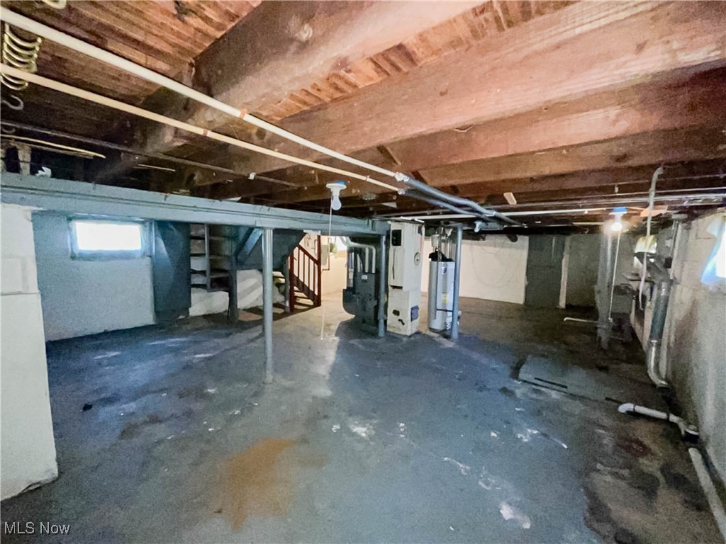 14703 Granger Road Maple Heights, OH 44137 - Photo 31 of 35 Basement featuring stairway and gas water heater