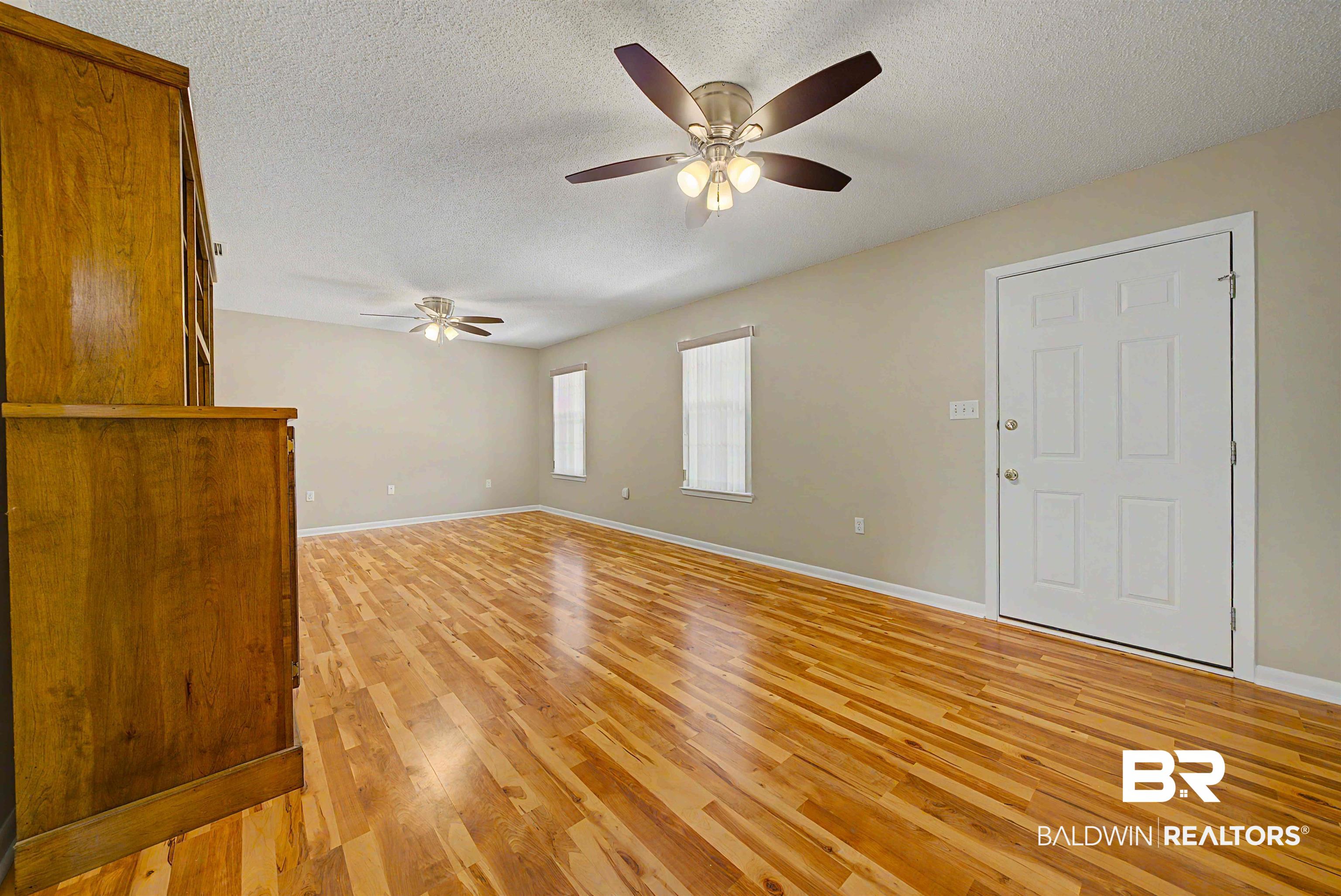 22963 Highway 98 Foley, AL 36535 - Photo 9 of 52 Spacious room with light wood-finish flooring