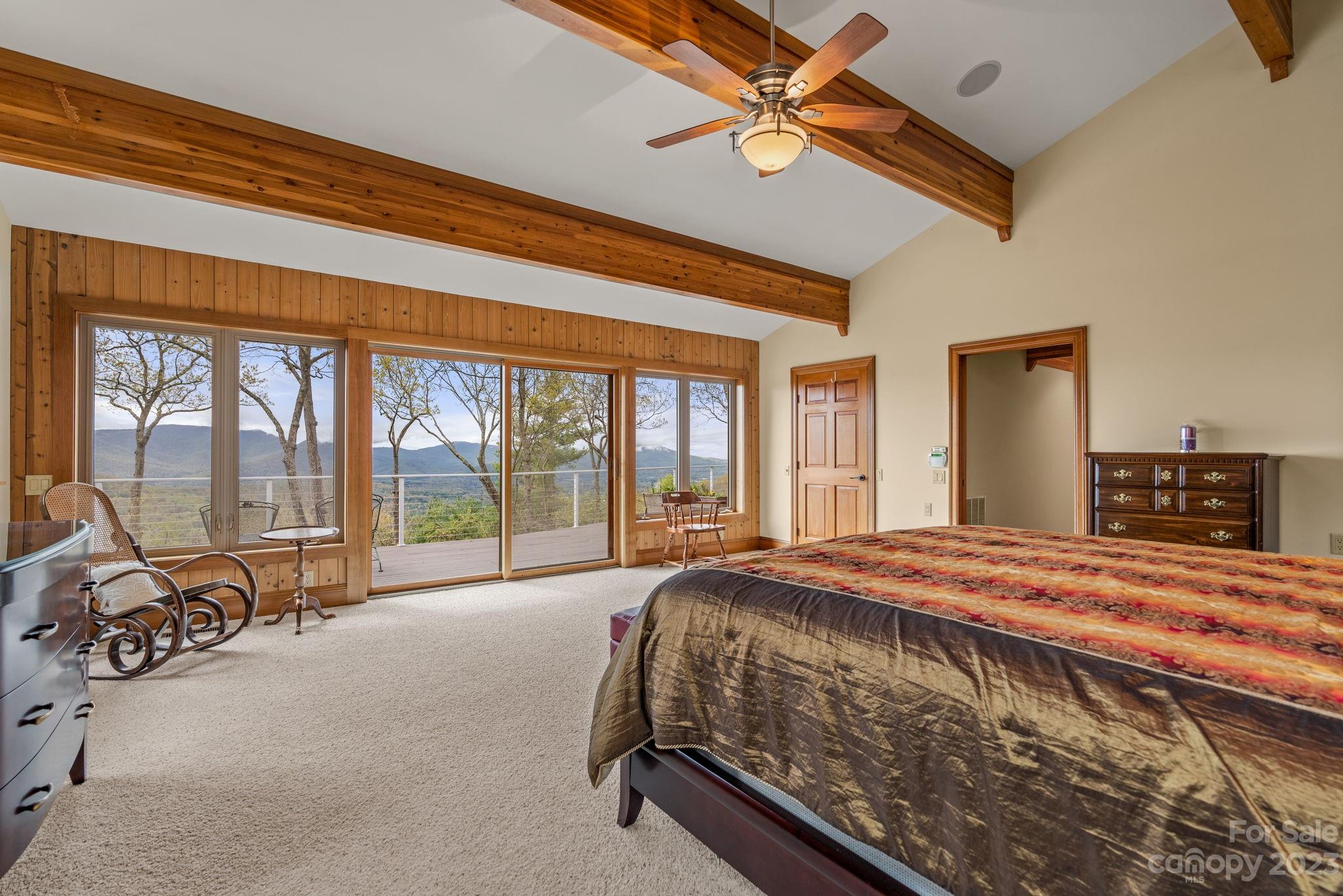 202 Mt Olive Drive Asheville, NC 28804 - Photo 12 of 48 a bed sitting in a spacious bedroom next to a window