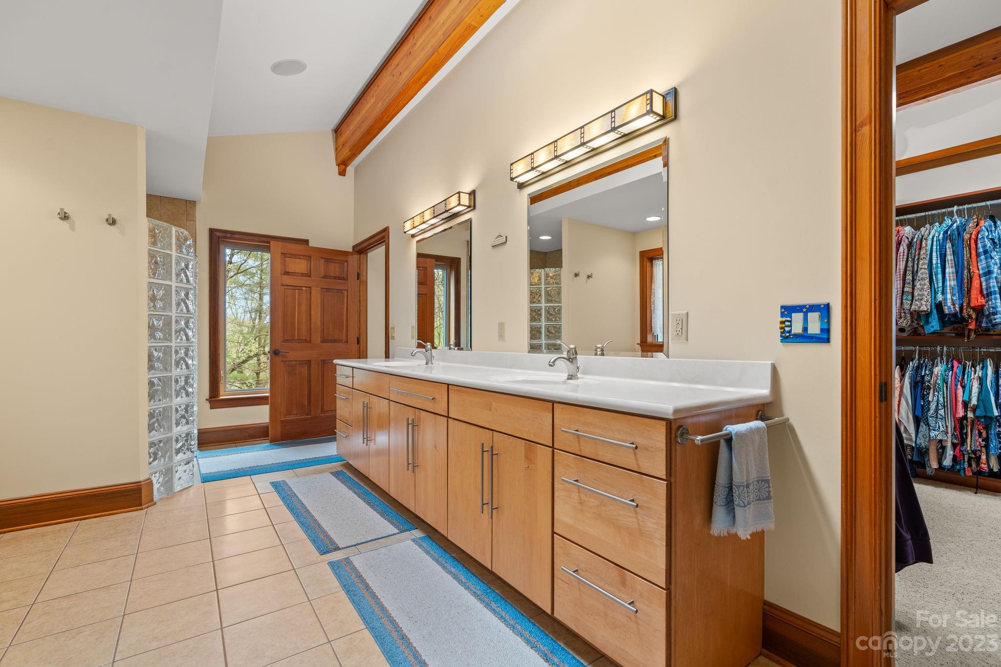 202 Mt Olive Drive Asheville, NC 28804 - Photo 14 of 48 a spacious bathroom with a sink and a mirror