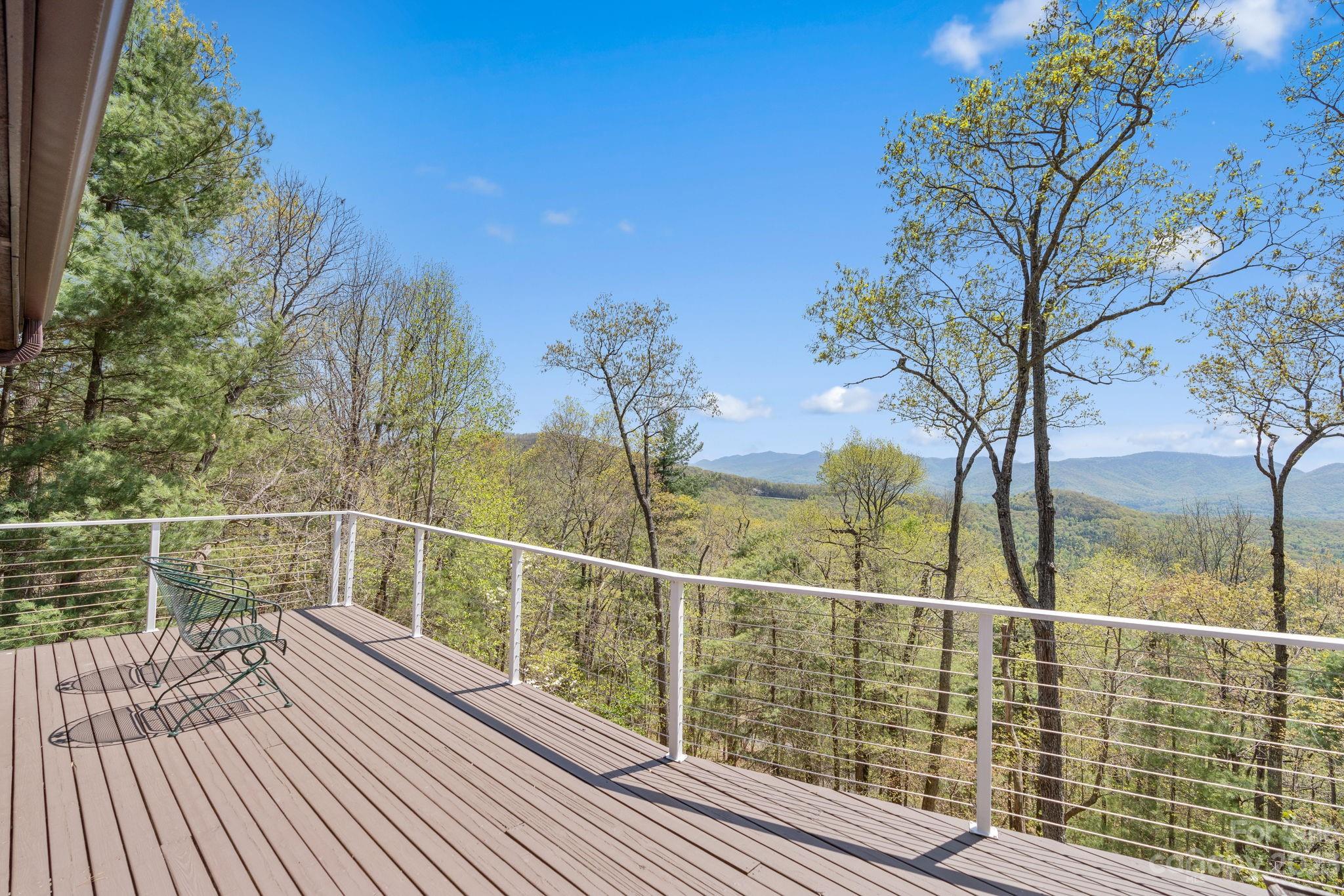 202 Mt Olive Drive Asheville, NC 28804 - Photo 17 of 48 a view of a balcony with a floor to ceiling window next to a yard