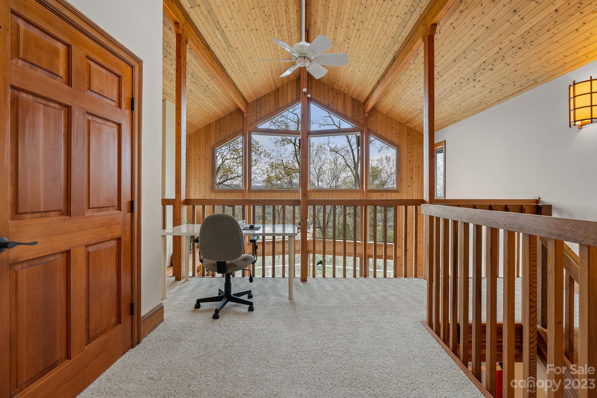 202 Mt Olive Drive Asheville, NC 28804 - Photo 27 of 48 a view of a porch with wooden floor and windows