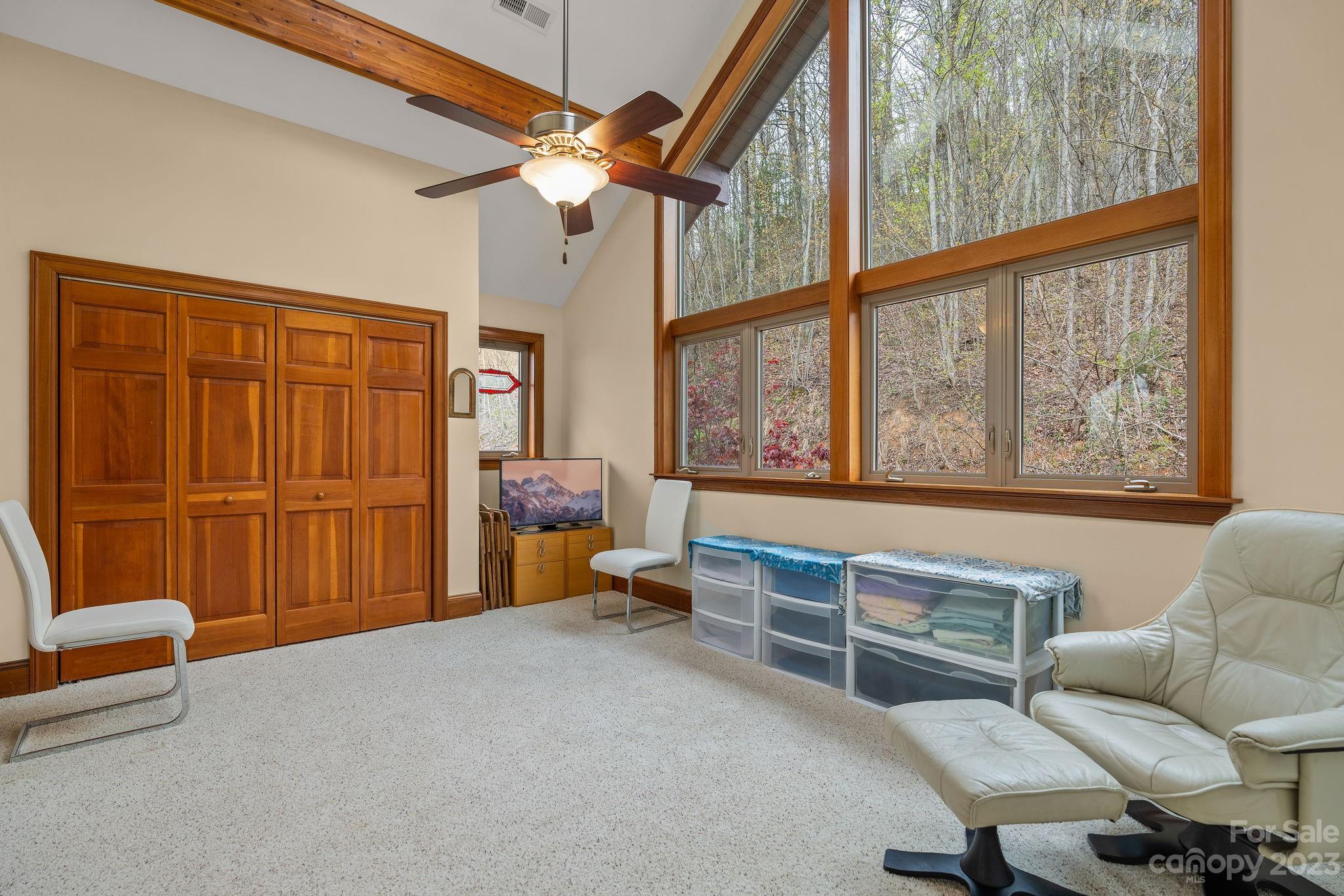 202 Mt Olive Drive Asheville, NC 28804 - Photo 29 of 48 a bedroom with furniture and a large window