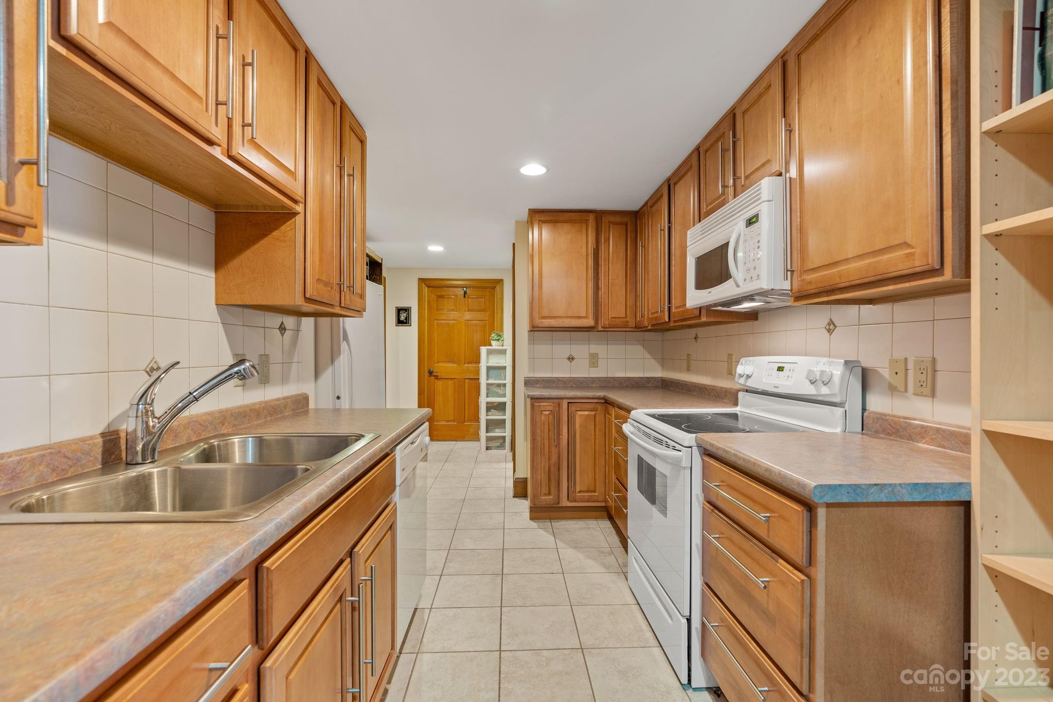 202 Mt Olive Drive Asheville, NC 28804 - Photo 37 of 48 a kitchen that has a sink and a stove