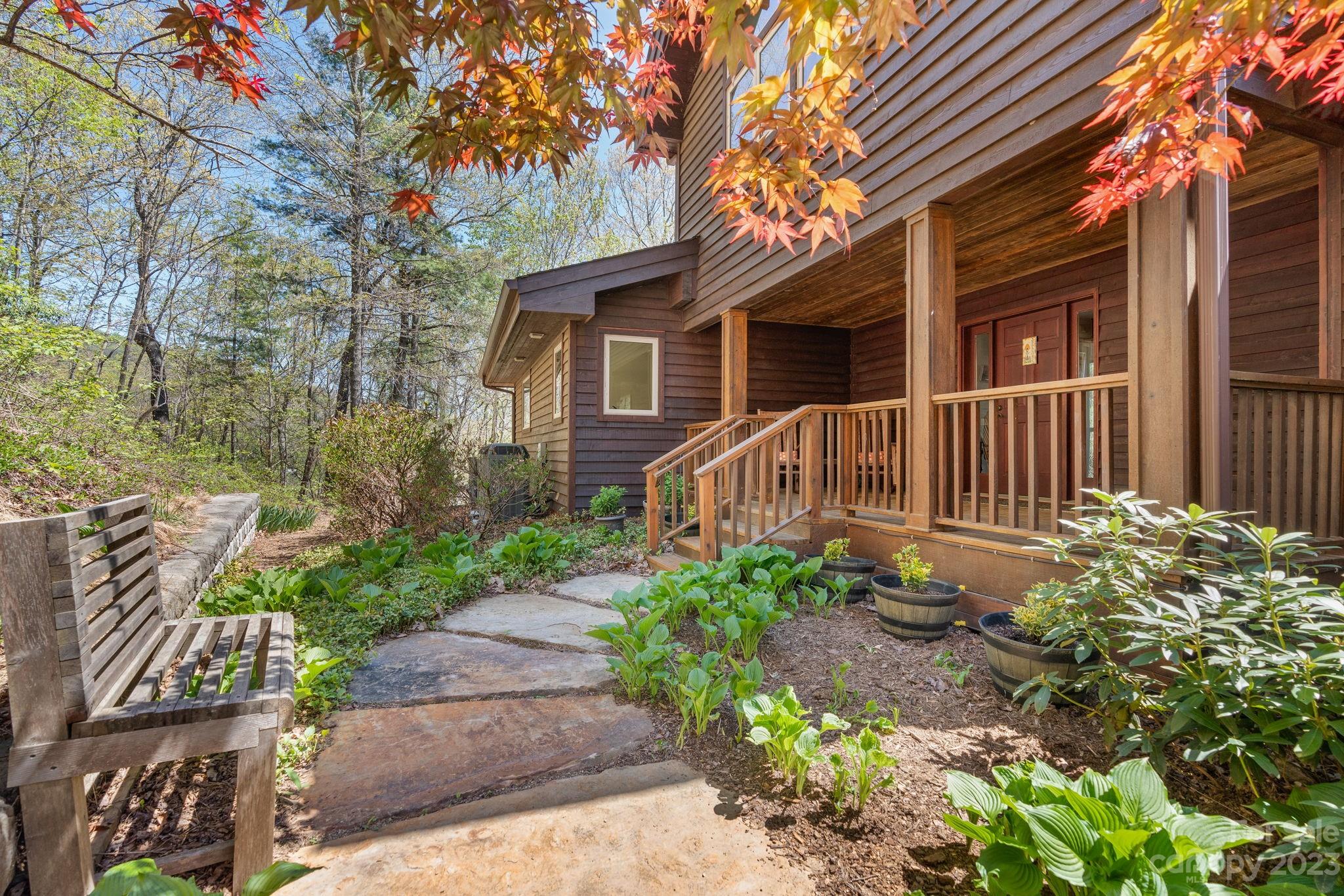 202 Mt Olive Drive Asheville, NC 28804 - Photo 4 of 48 a front view of a house with garden