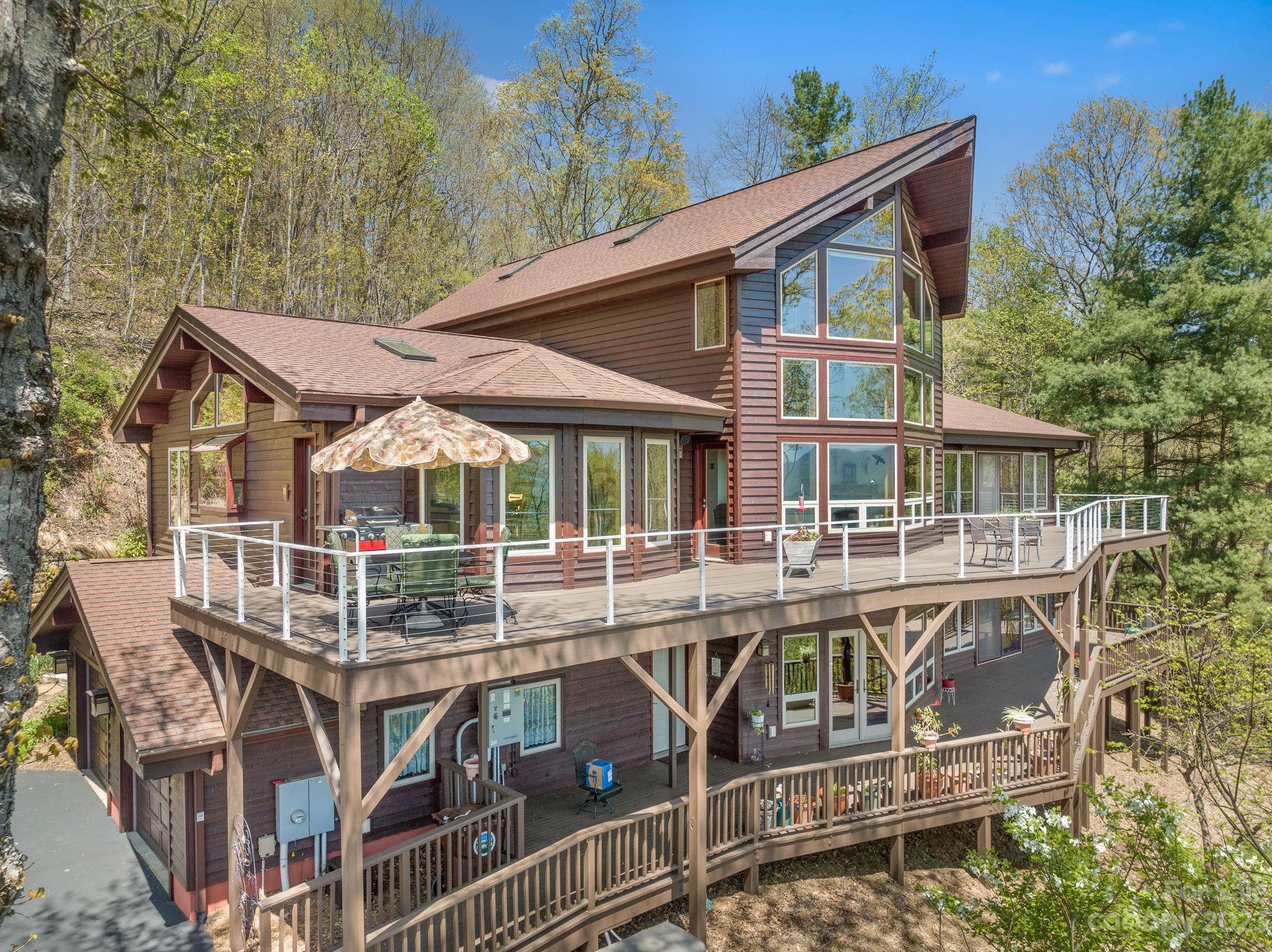 202 Mt Olive Drive Asheville, NC 28804 - Photo 42 of 48 a view of a house with backyard porch and sitting area