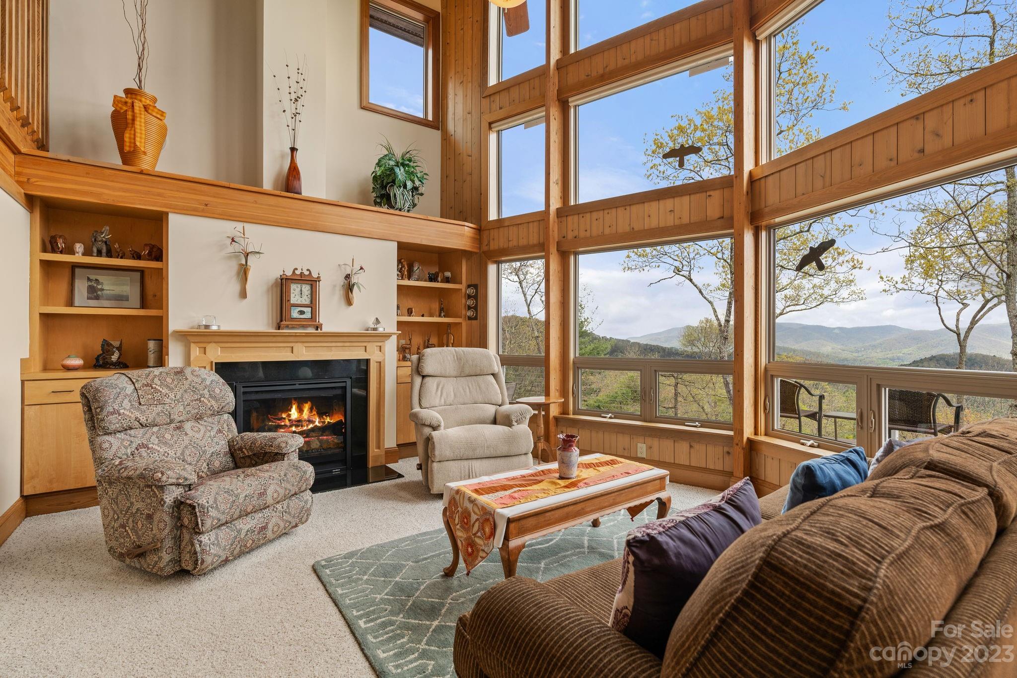 202 Mt Olive Drive Asheville, NC 28804 - Photo 7 of 48 a living room with furniture fireplace and a large window