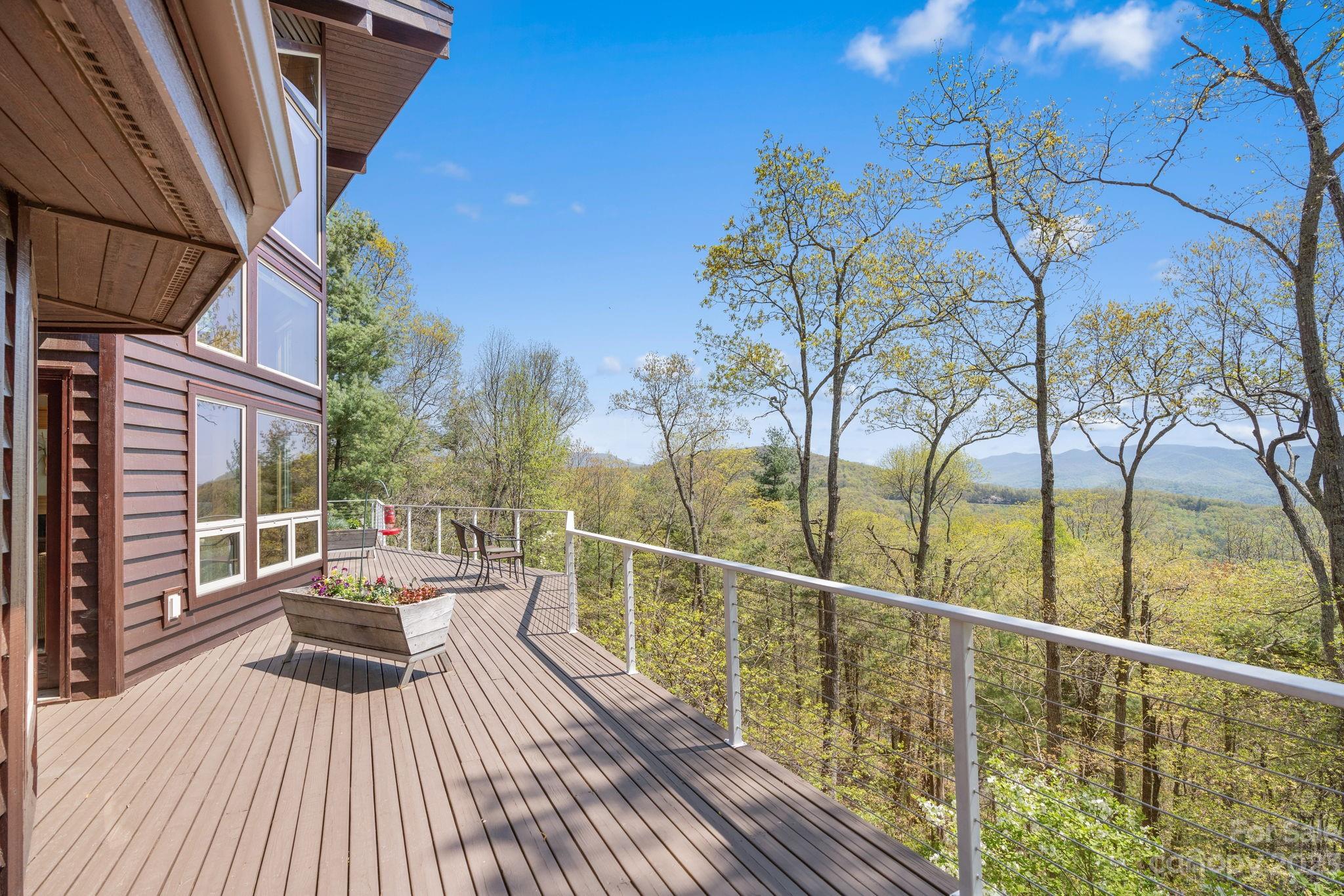 202 Mt Olive Drive Asheville, NC 28804 - Photo 10 of 48 a view of balcony with wooden floor and fence