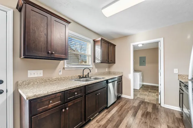 a kitchen with a refrigerator stove and microwave