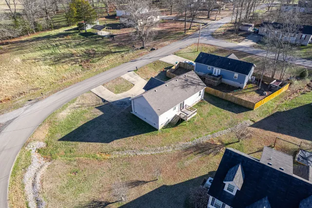 a view of balcony with wooden floor and fence
