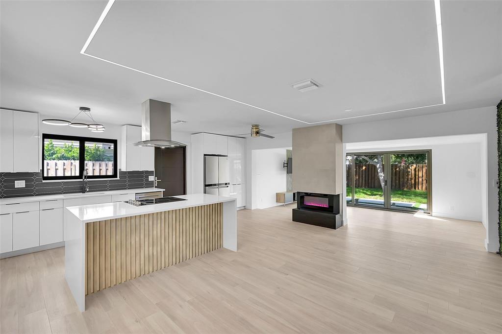 1257 Northwest 4th Street Boca Raton, FL 33486 - Photo 4 of 23 a large white kitchen with a large window
