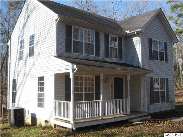 6323 Community House Road Columbia, VA 23038 - Photo 1 of 11 a view of a house with a small yard and wooden floor and fence