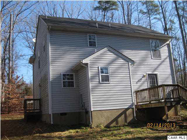 6323 Community House Road Columbia, VA 23038 - Photo 2 of 11 a small white building with a white roof and wooden fence