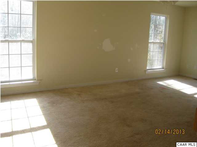 6323 Community House Road Columbia, VA 23038 - Photo 4 of 11 an empty room with windows