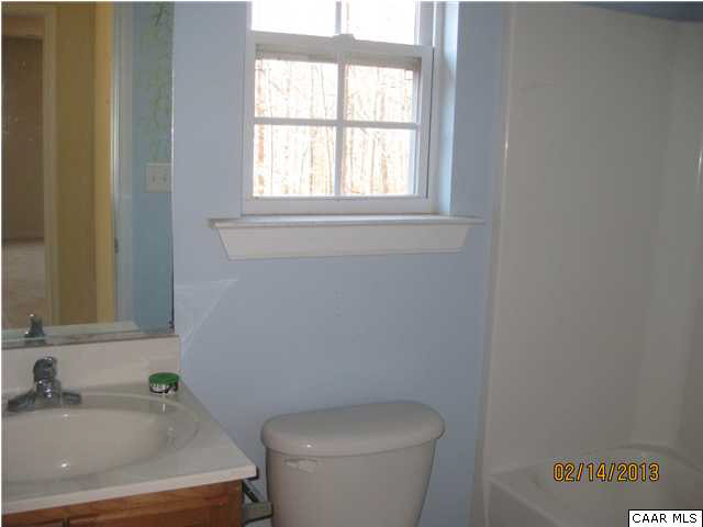 6323 Community House Road Columbia, VA 23038 - Photo 5 of 11 a bathroom with a sink and a toilet