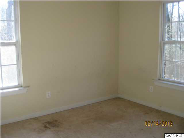 6323 Community House Road Columbia, VA 23038 - Photo 10 of 11 an empty room with windows