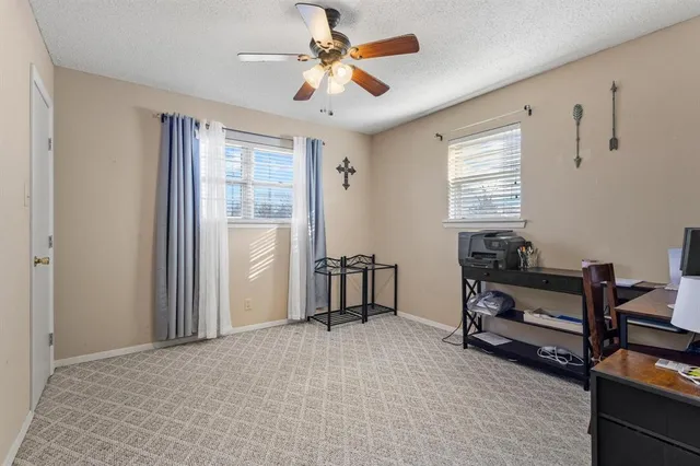 a view of workspace with furniture and windows