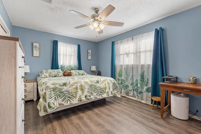 a bedroom with a bed and a table