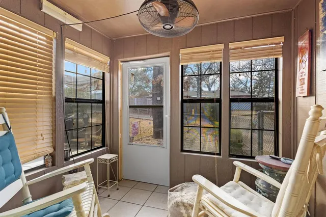 a view of a room with furniture and windows