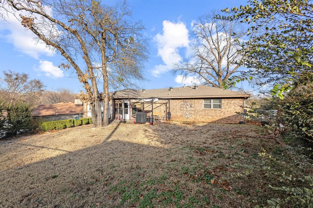 3013 Belle Avenue Denison, TX 75020 - Photo 32 of 32 a view of a house with a snow on the road