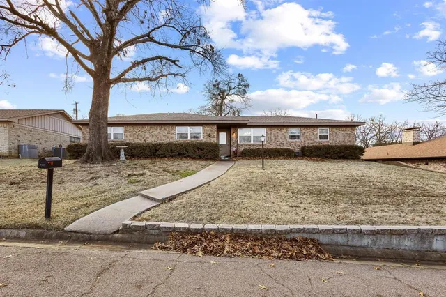a view of a yard with car parked