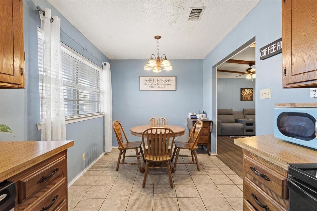 3013 Belle Avenue Denison, TX 75020 - Photo 9 of 32 a dining room with furniture and window