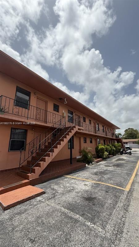 1716 Northwest 19th Street Miami, FL 33125 - Photo 4 of 4 a view of a house with wooden fence