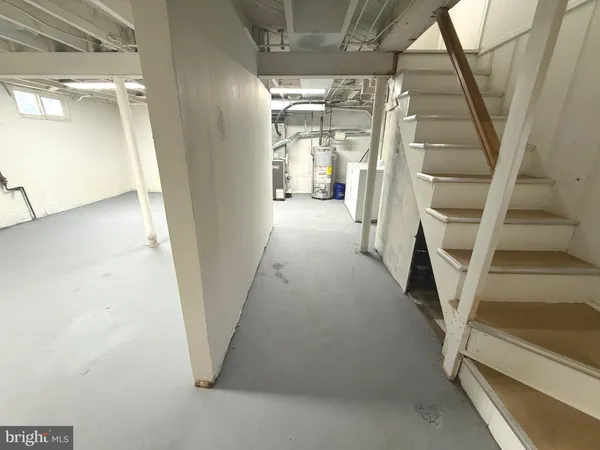 a view of empty room with wooden ceiling