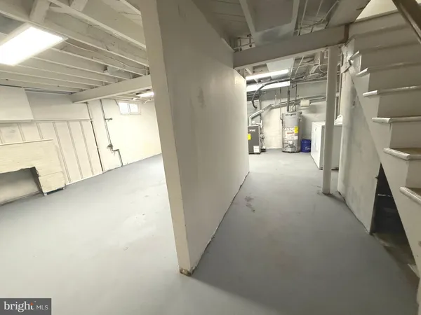 a bathroom with a granite countertop toilet and a shower