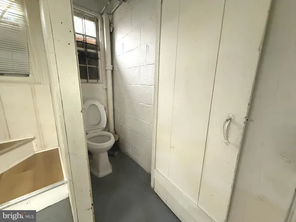 a bathroom with a toilet and a sink
