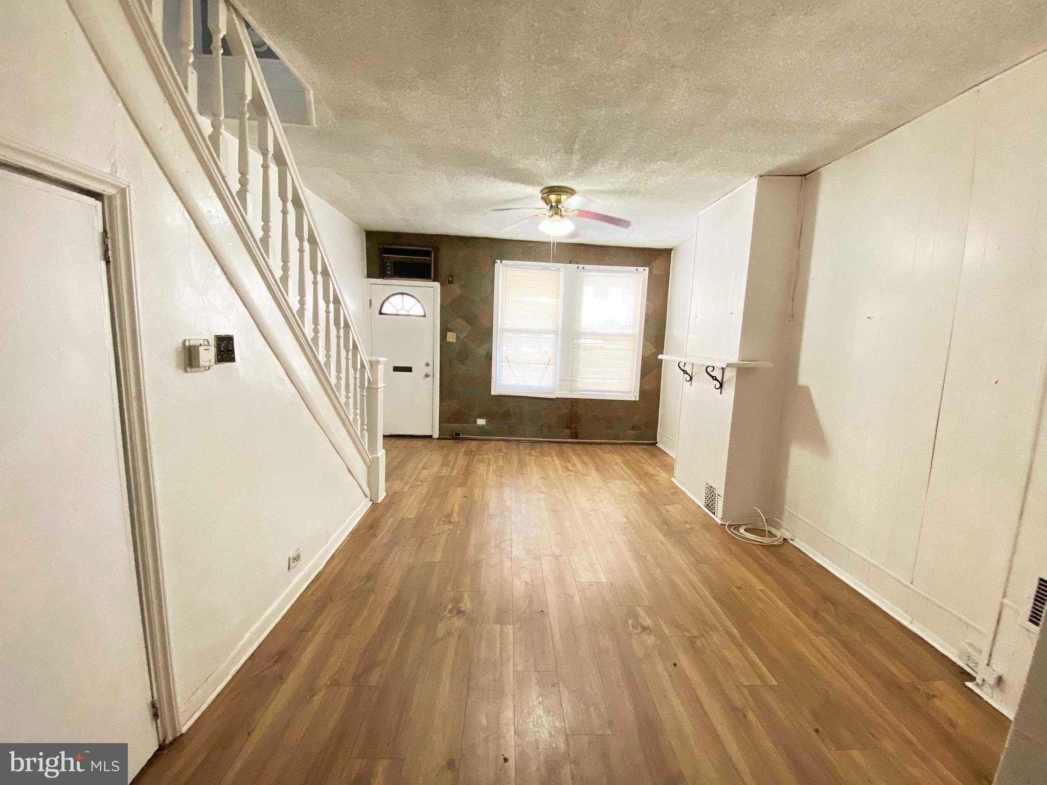 3342 Malta Street Philadelphia, PA 19134 - Photo 11 of 39 a view of a hallway with wooden floor and staircase
