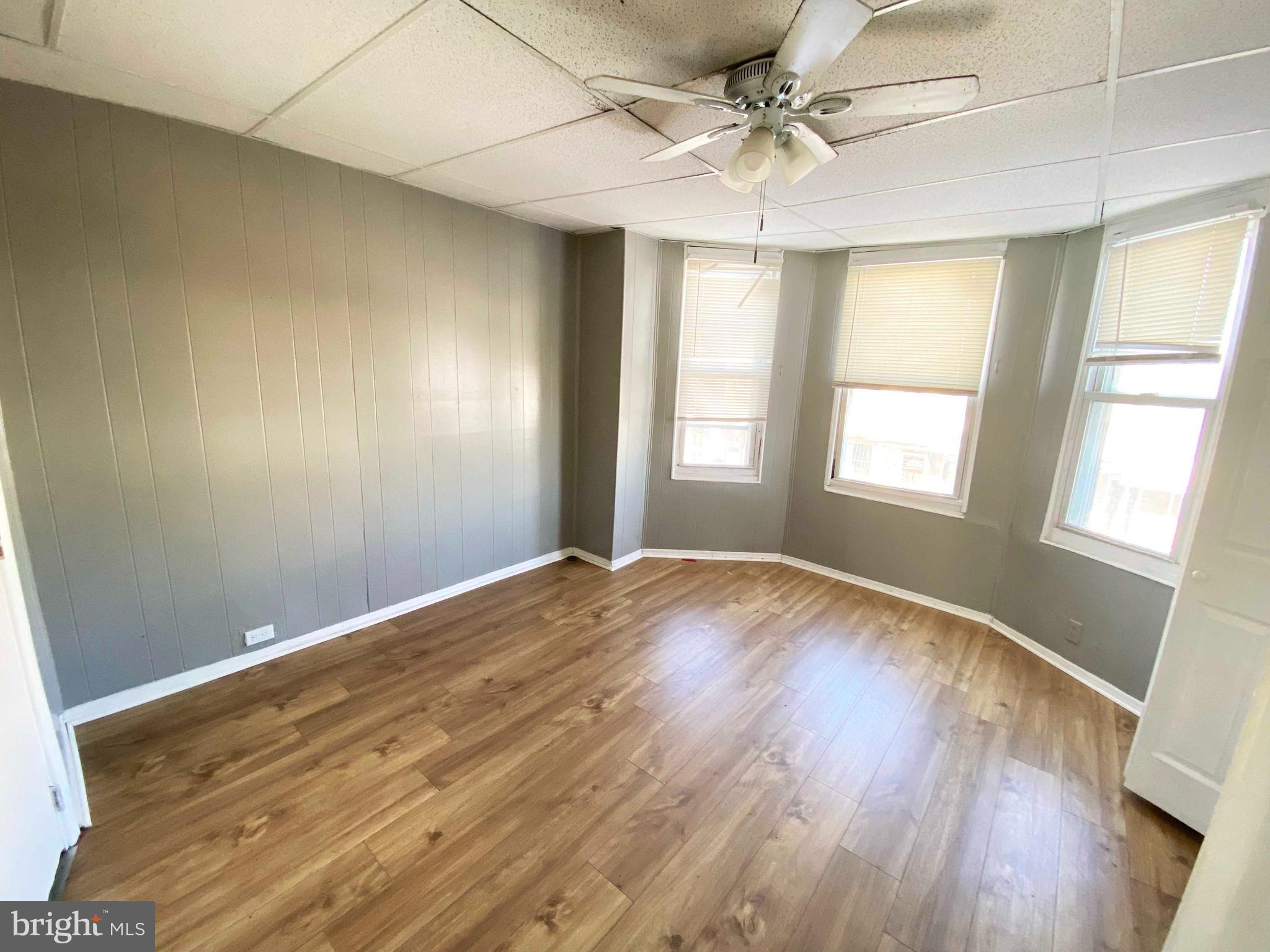 3342 Malta Street Philadelphia, PA 19134 - Photo 21 of 39 a view of empty room with wooden floor and fan
