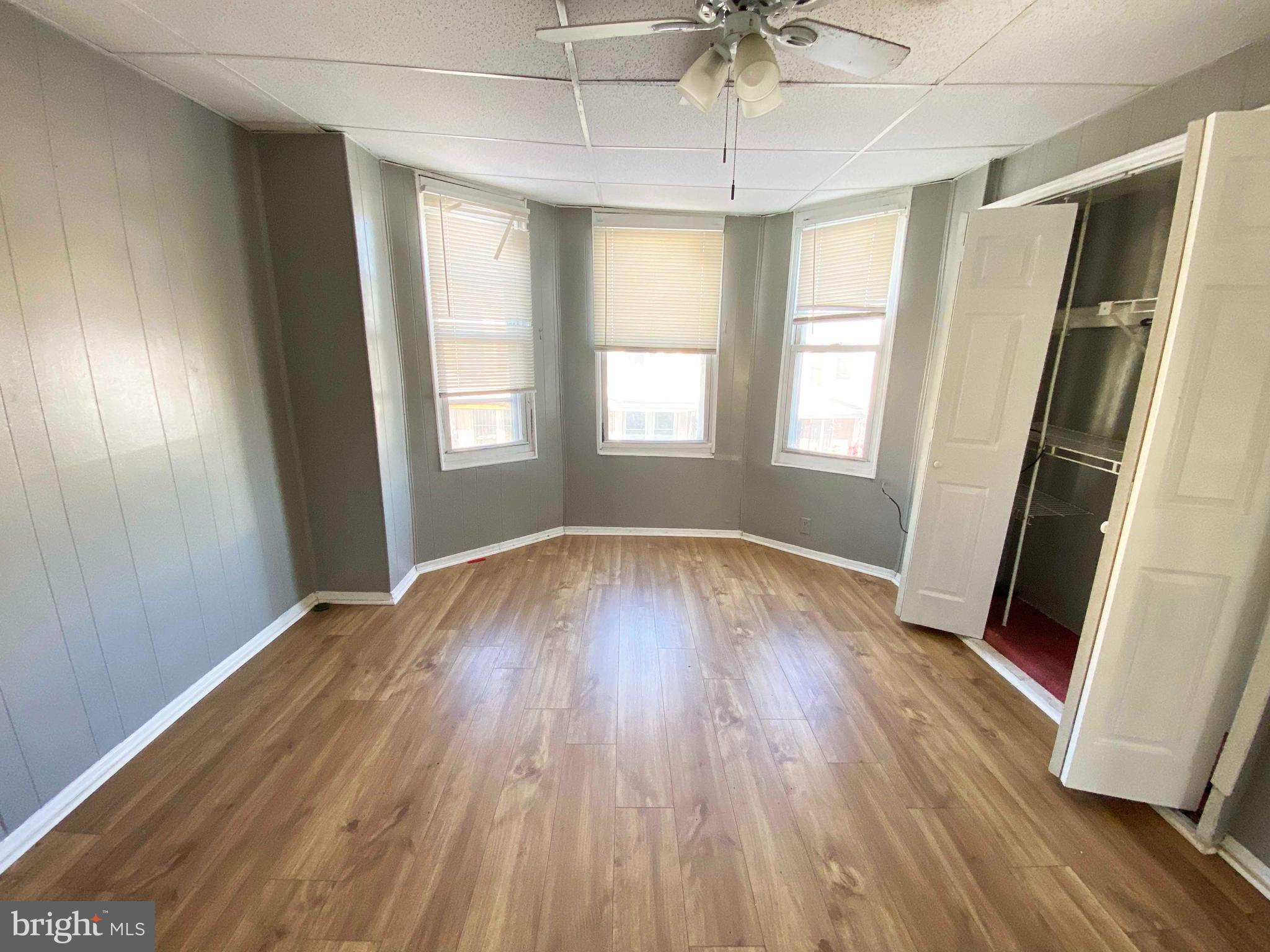 3342 Malta Street Philadelphia, PA 19134 - Photo 22 of 39 an empty room with wooden floor and windows