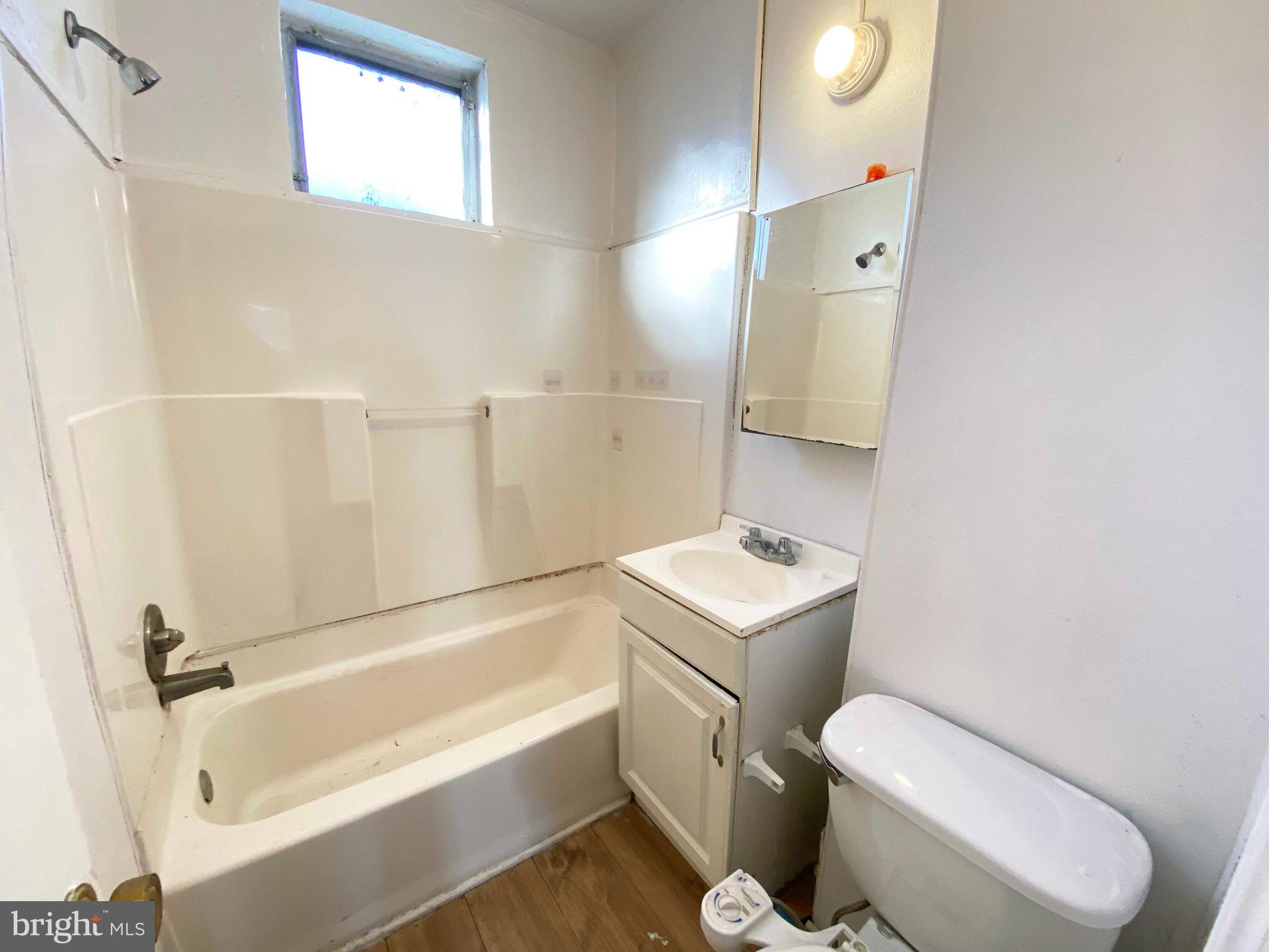 3342 Malta Street Philadelphia, PA 19134 - Photo 26 of 39 a bathroom with a sink a toilet and bathtub