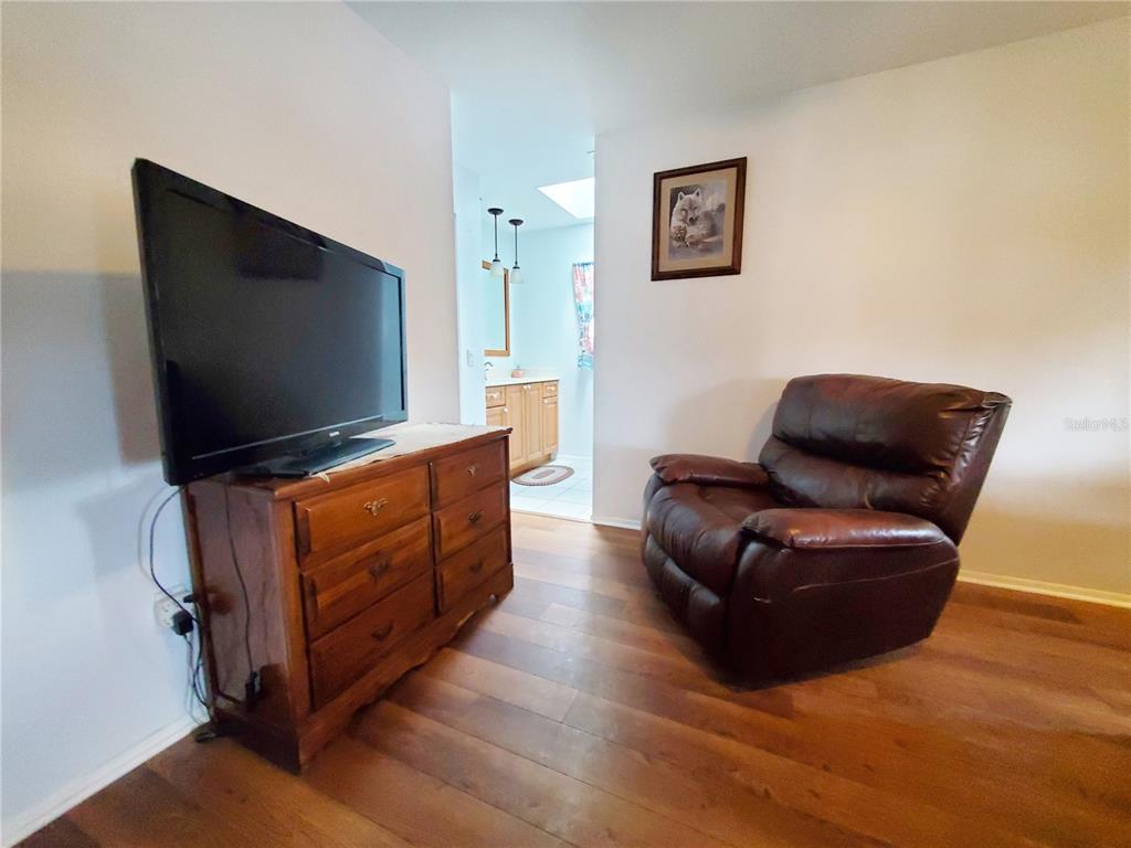 3456 Highlands Road Punta Gorda, FL 33983 - Photo 18 of 80 a living room with furniture and a flat screen tv
