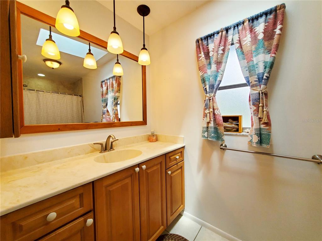 3456 Highlands Road Punta Gorda, FL 33983 - Photo 20 of 80 a bathroom with a sink and a mirror