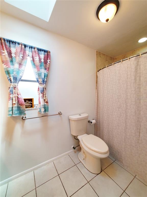 3456 Highlands Road Punta Gorda, FL 33983 - Photo 21 of 80 a bathroom with a toilet sink and mirror