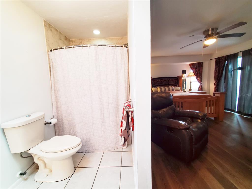 3456 Highlands Road Punta Gorda, FL 33983 - Photo 23 of 80 a bathroom with a toilet a sink and a mirror