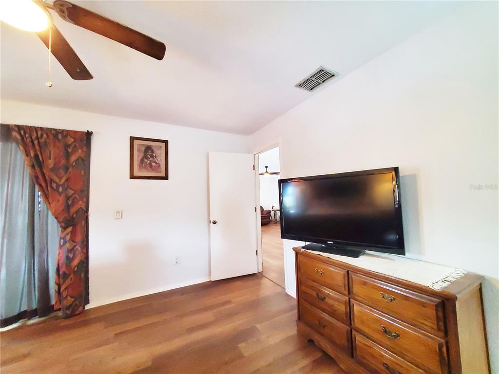 3456 Highlands Road Punta Gorda, FL 33983 - Photo 24 of 80 a living room with furniture and a flat screen tv