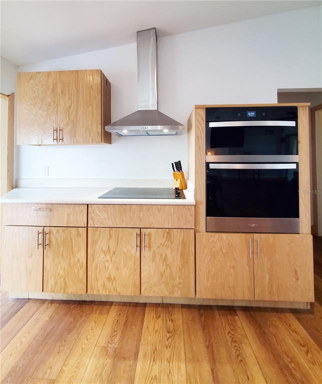 3456 Highlands Road Punta Gorda, FL 33983 - Photo 29 of 80 a view of a kitchen with wooden floor and electronic appliances