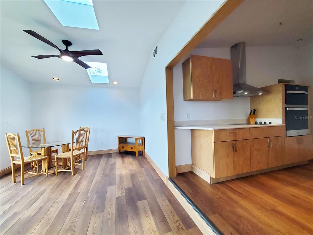 3456 Highlands Road Punta Gorda, FL 33983 - Photo 31 of 80 a kitchen with a wooden table and chairs