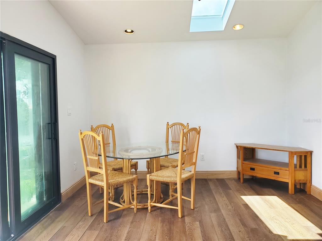 3456 Highlands Road Punta Gorda, FL 33983 - Photo 33 of 80 a dining room with furniture and wooden floor