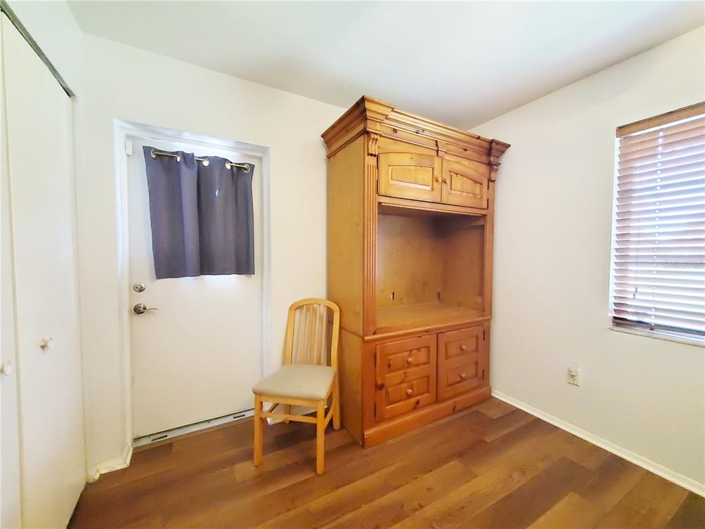 3456 Highlands Road Punta Gorda, FL 33983 - Photo 42 of 80 a view of a livingroom with wooden floor and a bathroom