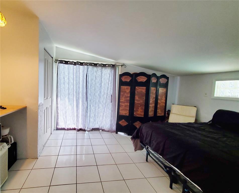 3456 Highlands Road Punta Gorda, FL 33983 - Photo 44 of 80 a living room with a large window and a walk in closet