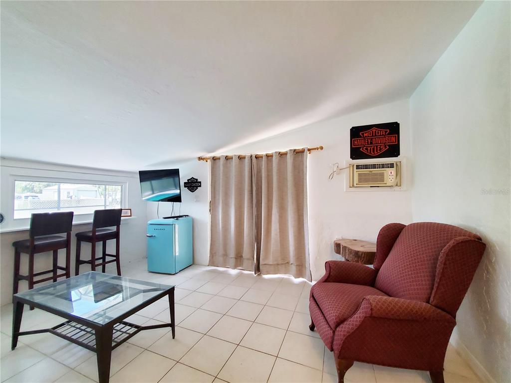 3456 Highlands Road Punta Gorda, FL 33983 - Photo 48 of 80 a living room with furniture a dining table and a window