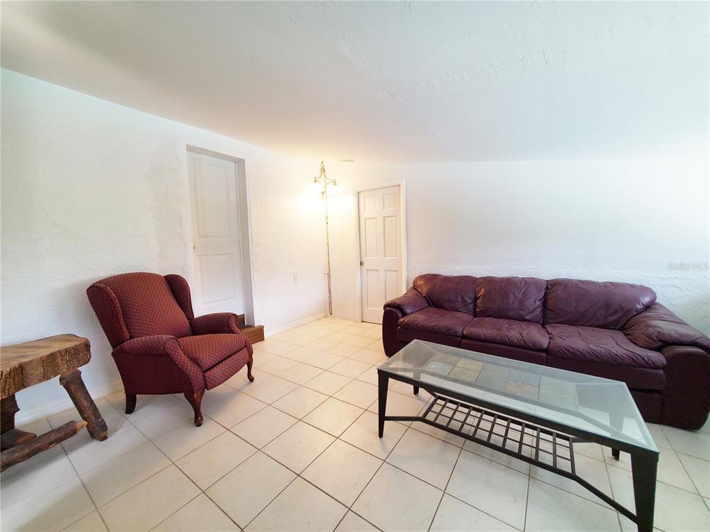 3456 Highlands Road Punta Gorda, FL 33983 - Photo 50 of 80 a living room with furniture and a couch