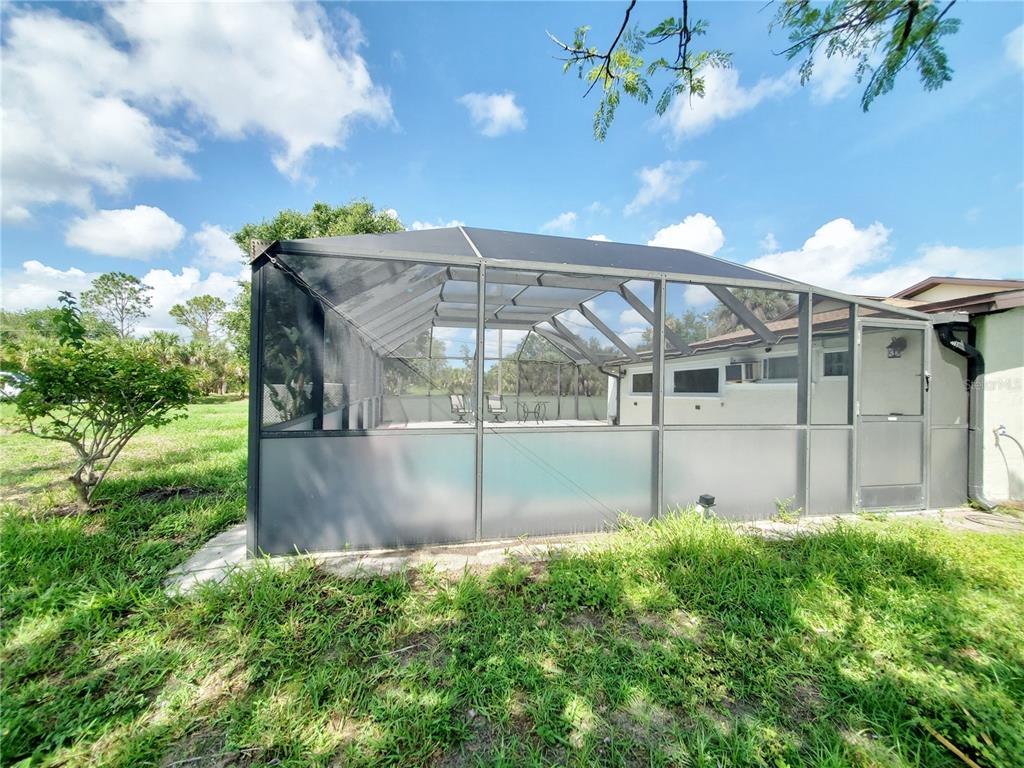 3456 Highlands Road Punta Gorda, FL 33983 - Photo 60 of 80 a view of a house with a yard